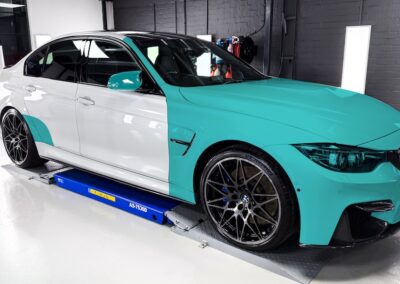 BMW PPF installation on a white BMW